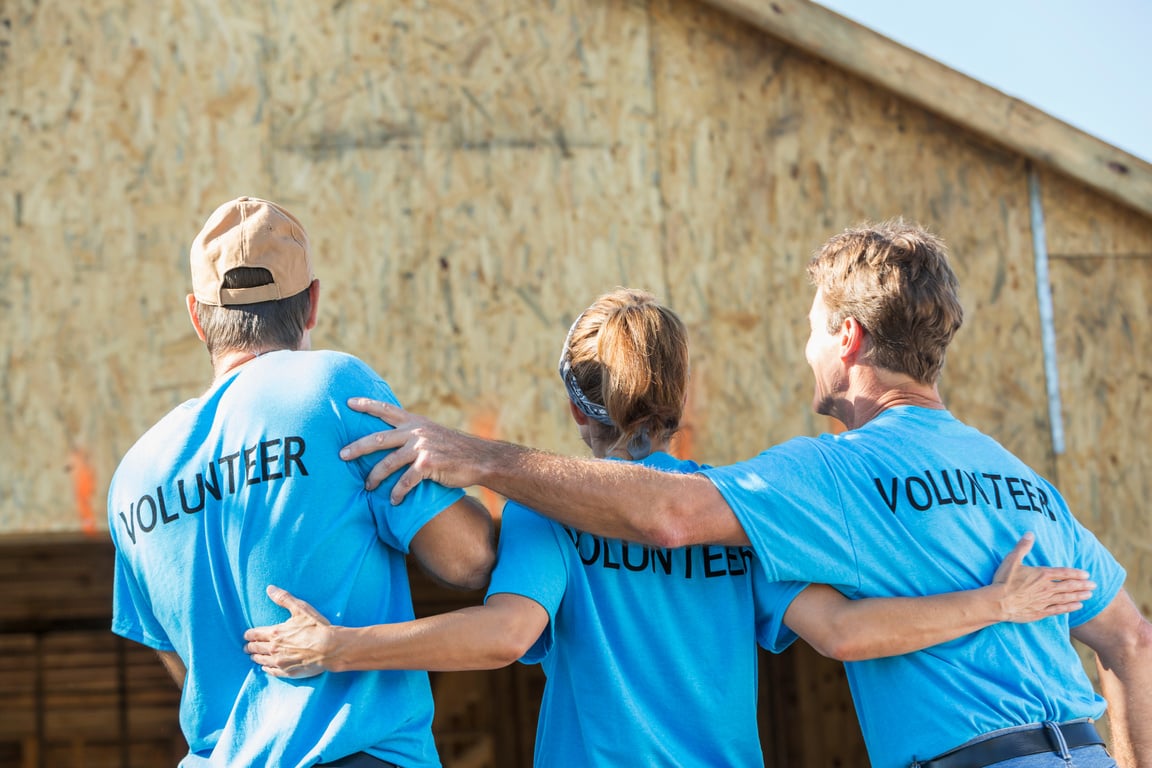 Volunteers helping to build homes for the needy